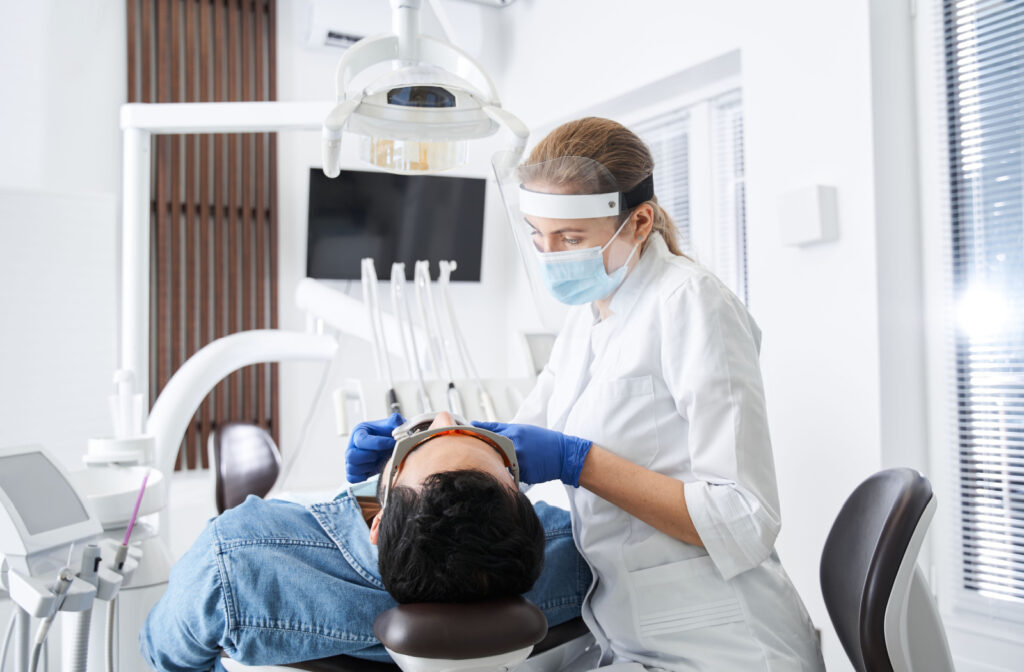 Dentist performing an exam on a patient.