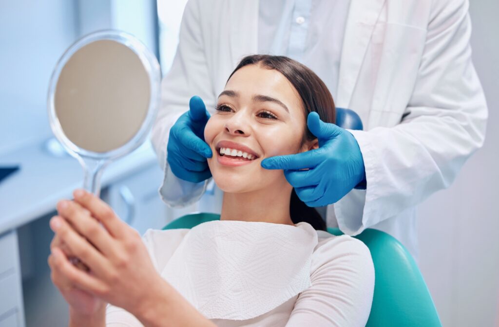 A patient smiling after her dental exam in Vernon.